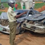 A trace operative with some of the damaged vehicle